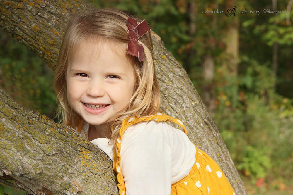 Young girl posing for a fall photo
