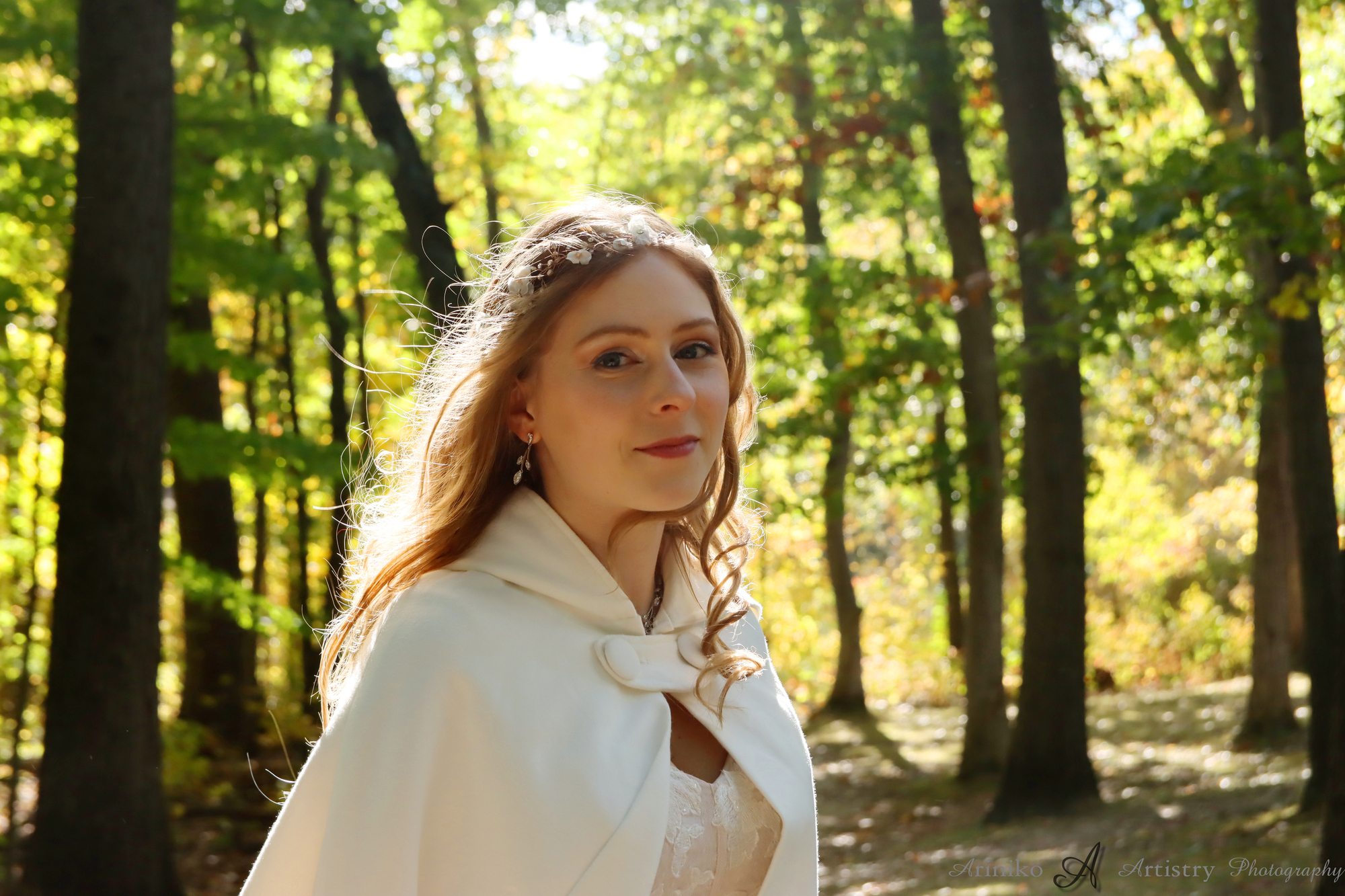 Young woman walking through field for her senior portraits