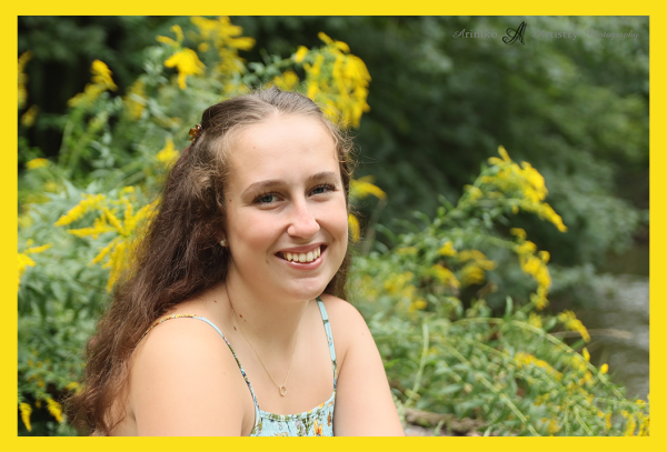 young person posing near the river in Charlotte, Michigan