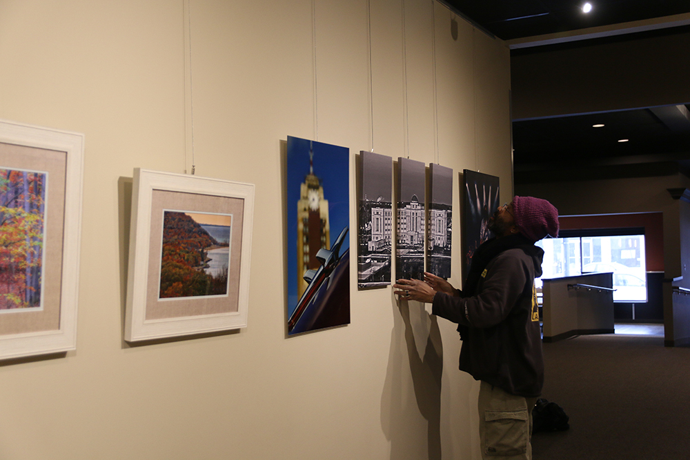 Artists hanging art at the Art & Craft Beer Festival