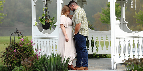 Couple posing in gazebo at Meridian Historical Village
