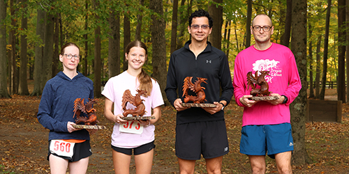 Winners with their dragon awards from the Dragon in the Woods 5K race in Holt, Michigan