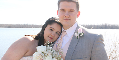Couple pose after their wedding