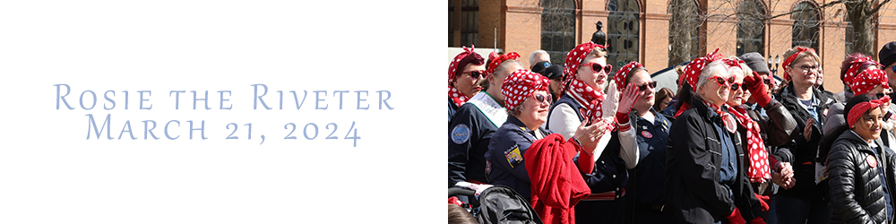 Women dressed like Rosie the Riveter at the Michigan State Capitol for National Rosie the Riveter Day