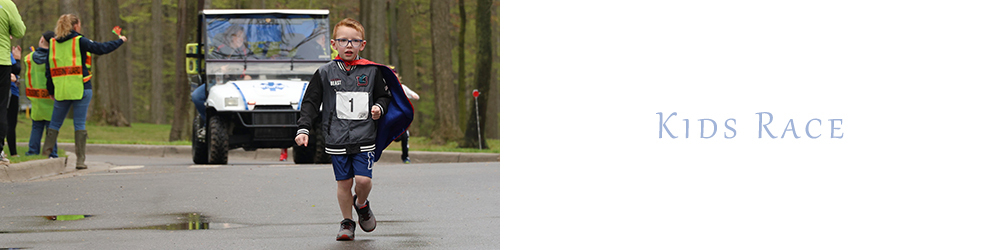 A young boy with red hair running in a kids race