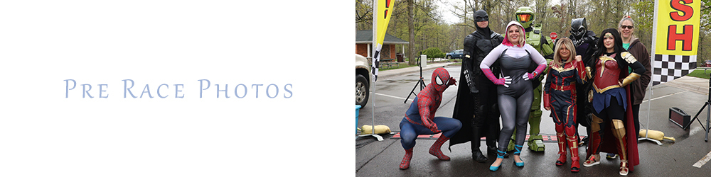 A group of adults dressed like superheroes. 