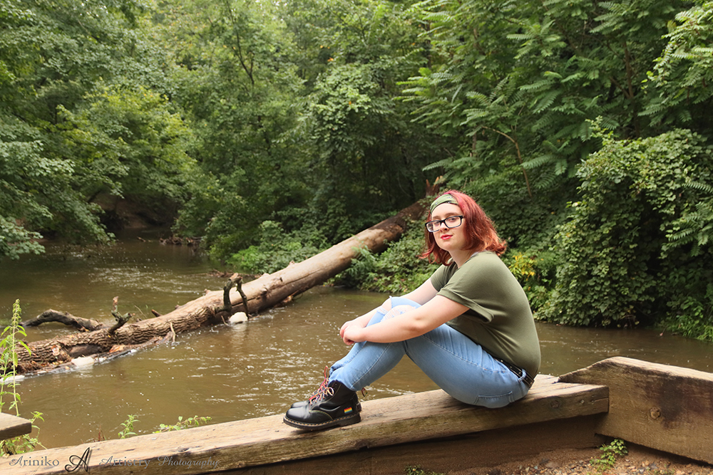 young person posing near the river in Charlotte, Michigan
