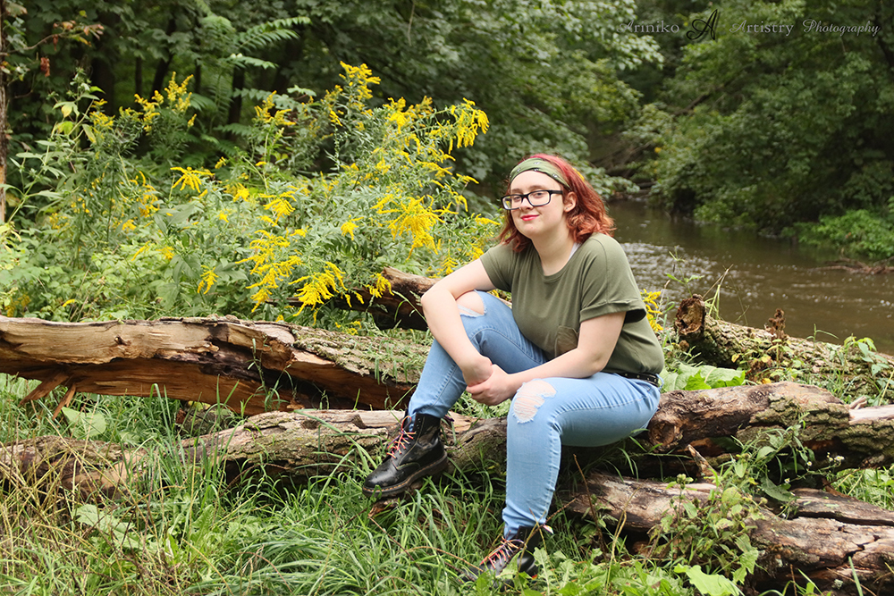 senior posing on the river banks in Charlotte, Michigan