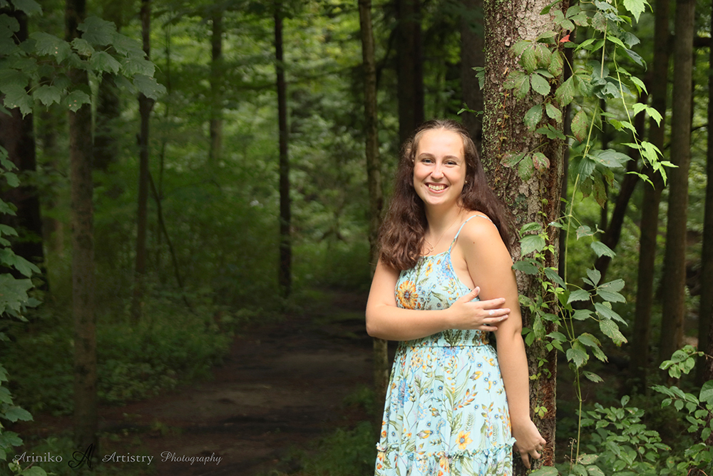 young woman posing on the banks of the river in Charlotte, Michigan