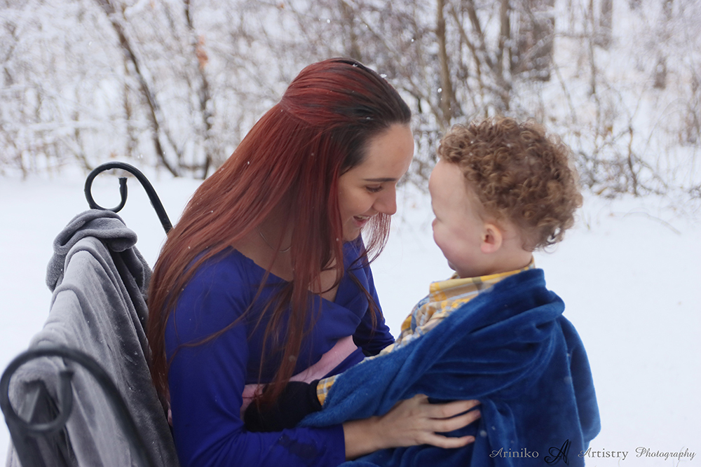 Mother and son posing during a maternity session at Harris Nature Center in Okemos, Michigan